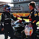 NORTHAMPTON, ENGLAND - JULY 17: Winner Max Verstappen of Netherlands and Red Bull Racing and second placed Lewis Hamilton of Great Britain and Mercedes GP bump fists in parc ferme during the Sprint for the F1 Grand Prix of Great Britain at Silverstone on July 17, 2021 in Northampton, England. (Photo by Mark Thompson/Getty Images)