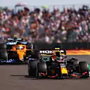 NORTHAMPTON, ENGLAND - JULY 17: Sergio Perez of Mexico driving the (11) Red Bull Racing RB16B Honda leads Daniel Ricciardo of Australia driving the (3) McLaren F1 Team MCL35M Mercedes during the Sprint for the F1 Grand Prix of Great Britain at Silverstone on July 17, 2021 in Northampton, England. (Photo by Lars Baron/Getty Images)