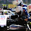 NORTHAMPTON, ENGLAND - JULY 18: Mick Schumacher of Germany driving the (47) Haas F1 Team VF-21 Ferrari makes a pitstop during the F1 Grand Prix of Great Britain at Silverstone on July 18, 2021 in Northampton, England. (Photo by Peter Fox/Getty Images)