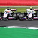 NORTHAMPTON, ENGLAND - JULY 18: Nikita Mazepin of Russia driving the (9) Haas F1 Team VF-21 Ferrari and Mick Schumacher of Germany driving the (47) Haas F1 Team VF-21 Ferrari battle for position during the F1 Grand Prix of Great Britain at Silverstone on July 18, 2021 in Northampton, England. (Photo by Michael Regan/Getty Images)