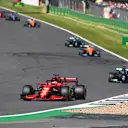 NORTHAMPTON, ENGLAND - JULY 18: Charles Leclerc of Monaco driving the (16) Scuderia Ferrari SF21 leads Lewis Hamilton of Great Britain driving the (44) Mercedes AMG Petronas F1 Team Mercedes W12 during the F1 Grand Prix of Great Britain at Silverstone on July 18, 2021 in Northampton, England. (Photo by Michael Regan/Getty Images)