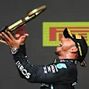 NORTHAMPTON, ENGLAND - JULY 18: Race winner Lewis Hamilton of Great Britain and Mercedes GP celebrates on the podium during the F1 Grand Prix of Great Britain at Silverstone on July 18, 2021 in Northampton, England. (Photo by Michael Regan/Getty Images)