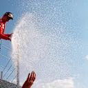 NORTHAMPTON, ENGLAND - JULY 18: Second placed Charles Leclerc of Monaco and Ferrari celebrates on the podium  during the F1 Grand Prix of Great Britain at Silverstone on July 18, 2021 in Northampton, England. (Photo by Mark Thompson/Getty Images)
