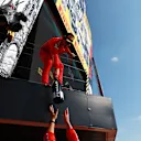 NORTHAMPTON, ENGLAND - JULY 18: Second placed Charles Leclerc of Monaco and Ferrari celebrates on the podium  during the F1 Grand Prix of Great Britain at Silverstone on July 18, 2021 in Northampton, England. (Photo by Mark Thompson/Getty Images)