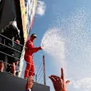 NORTHAMPTON, ENGLAND - JULY 18: Second placed Charles Leclerc of Monaco and Ferrari celebrates on the podium  during the F1 Grand Prix of Great Britain at Silverstone on July 18, 2021 in Northampton, England. (Photo by Mark Thompson/Getty Images)