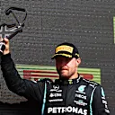 NORTHAMPTON, ENGLAND - JULY 18: Third placed Valtteri Bottas of Finland and Mercedes GP celebrates on the podium during the F1 Grand Prix of Great Britain at Silverstone on July 18, 2021 in Northampton, England. (Photo by Dan Istitene - Formula 1/Formula 1 via Getty Images)