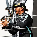 NORTHAMPTON, ENGLAND - JULY 18: Race winner Lewis Hamilton of Great Britain and Mercedes GP celebrates on the podium during the F1 Grand Prix of Great Britain at Silverstone on July 18, 2021 in Northampton, England. (Photo by Bryn Lennon - Formula 1/Formula 1 via Getty Images)