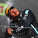 NORTHAMPTON, ENGLAND - JULY 18: Race winner Lewis Hamilton of Great Britain and Mercedes GP celebrates on the podium during the F1 Grand Prix of Great Britain at Silverstone on July 18, 2021 in Northampton, England. (Photo by Dan Istitene - Formula 1/Formula 1 via Getty Images)