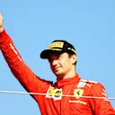 NORTHAMPTON, ENGLAND - JULY 18: Second placed Charles Leclerc of Monaco and Ferrari celebrates on the podium  during the F1 Grand Prix of Great Britain at Silverstone on July 18, 2021 in Northampton, England. (Photo by Bryn Lennon - Formula 1/Formula 1 via Getty Images)