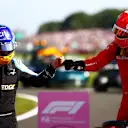NORTHAMPTON, ENGLAND - JULY 18: Second placed Charles Leclerc of Monaco and Ferrari is congratulated by Fernando Alonso of Spain and Alpine F1 Team in parc ferme during the F1 Grand Prix of Great Britain at Silverstone on July 18, 2021 in Northampton, England. (Photo by Dan Istitene - Formula 1/Formula 1 via Getty Images)
