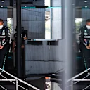 BUDAPEST, HUNGARY - JULY 30: Lewis Hamilton of Great Britain and Mercedes GP walks in the Paddock during practice ahead of the F1 Grand Prix of Hungary at Hungaroring on July 30, 2021 in Budapest, Hungary. (Photo by Rudy Carezzevoli - Formula 1/Formula 1 via Getty Images)