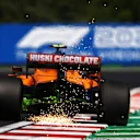 BUDAPEST, HUNGARY - JULY 30: Sparks fly behind Lando Norris of Great Britain driving the (4) McLaren F1 Team MCL35M Mercedes during practice ahead of the F1 Grand Prix of Hungary at Hungaroring on July 30, 2021 in Budapest, Hungary. (Photo by Bryn Lennon/Getty Images)
