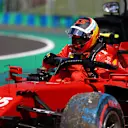 BUDAPEST, HUNGARY - JULY 31: Carlos Sainz of Spain driving the (55) Scuderia Ferrari SF21 climbs from his car after a crash during qualifying ahead of the F1 Grand Prix of Hungary at Hungaroring on July 31, 2021 in Budapest, Hungary. (Photo by Bryn Lennon/Getty Images)