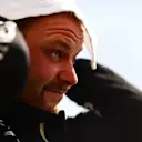 BUDAPEST, HUNGARY - JULY 31: Second place qualifier Valtteri Bottas of Finland and Mercedes GP wipes his head in parc ferme during qualifying ahead of the F1 Grand Prix of Hungary at Hungaroring on July 31, 2021 in Budapest, Hungary. (Photo by Mario Renzi - Formula 1/Formula 1 via Getty Images)