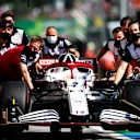 BUDAPEST, HUNGARY - JULY 31: The car of Kimi Raikkonen of Finland and Alfa Romeo Racing is pushed down the pitlane during qualifying ahead of the F1 Grand Prix of Hungary at Hungaroring on July 31, 2021 in Budapest, Hungary. (Photo by Peter Fox/Getty Images)