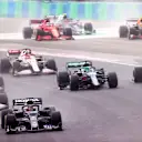 BUDAPEST, HUNGARY - AUGUST 01: Yuki Tsunoda of Japan driving the (22) Scuderia AlphaTauri AT02 Honda round turn one at the start during the F1 Grand Prix of Hungary at Hungaroring on August 01, 2021 in Budapest, Hungary. (Photo by Dan Istitene - Formula 1/Formula 1 via Getty Images)