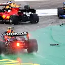 BUDAPEST, HUNGARY - AUGUST 01: Sergio Perez of Mexico driving the (11) Red Bull Racing RB16B Honda runs wide at the start as cars tangle ahead of him during the F1 Grand Prix of Hungary at Hungaroring on August 01, 2021 in Budapest, Hungary. (Photo by Bryn Lennon/Getty Images)