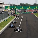 BUDAPEST, HUNGARY - AUGUST 01: George Russell of Great Britain driving the (63) Williams Racing FW43B Mercedes leads a line of cars out of the pitlane after pitting at the restart during the F1 Grand Prix of Hungary at Hungaroring on August 01, 2021 in Budapest, Hungary. (Photo by Bryn Lennon/Getty Images)