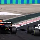 BUDAPEST, HUNGARY - AUGUST 01: Max Verstappen of the Netherlands driving the (33) Red Bull Racing RB16B Honda runs wide as he overtakes Mick Schumacher of Germany driving the (47) Haas F1 Team VF-21 Ferrari during the F1 Grand Prix of Hungary at Hungaroring on August 01, 2021 in Budapest, Hungary. (Photo by Bryn Lennon/Getty Images)