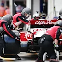 BUDAPEST, HUNGARY - AUGUST 01: Antonio Giovinazzi of Italy driving the (99) Alfa Romeo Racing C41 Ferrari makes a pitstop during the F1 Grand Prix of Hungary at Hungaroring on August 01, 2021 in Budapest, Hungary. (Photo by Peter Fox/Getty Images)