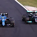 BUDAPEST, HUNGARY - AUGUST 01: Fernando Alonso of Spain driving the (14) Alpine A521 Renault defends from Lewis Hamilton of Great Britain driving the (44) Mercedes AMG Petronas F1 Team Mercedes W12 during the F1 Grand Prix of Hungary at Hungaroring on August 01, 2021 in Budapest, Hungary. (Photo by Lars Baron/Getty Images)