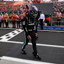 BUDAPEST, HUNGARY - AUGUST 01: Third placed Lewis Hamilton of Great Britain and Mercedes GP walks in parc ferme during the F1 Grand Prix of Hungary at Hungaroring on August 01, 2021 in Budapest, Hungary. (Photo by Florion Goga - Pool/Getty Images)
