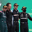 BUDAPEST, HUNGARY - AUGUST 01: Race winner Esteban Ocon of France and Alpine F1 Team, second placed Sebastian Vettel of Germany and Aston Martin F1 Team and third placed Lewis Hamilton of Great Britain and Mercedes GP celebrate on the podium during the F1 Grand Prix of Hungary at Hungaroring on August 01, 2021 in Budapest, Hungary. (Photo by Lars Baron/Getty Images)