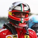 MONZA, ITALY - SEPTEMBER 10: Carlos Sainz of Spain and Ferrari walks in parc ferme during qualifying ahead of the F1 Grand Prix of Italy at Autodromo di Monza on September 10, 2021 in Monza, Italy. (Photo by Lars Baron/Getty Images)