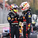 MONZA, ITALY - SEPTEMBER 10: Max Verstappen of Netherlands and Red Bull Racing and Sergio Perez of Mexico and Red Bull Racing talk in parc ferme during qualifying ahead of the F1 Grand Prix of Italy at Autodromo di Monza on September 10, 2021 in Monza, Italy. (Photo by Lars Baron/Getty Images)