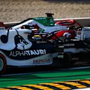 MONZA, ITALY - SEPTEMBER 11: Robert Kubica of Poland driving the (88) Alfa Romeo Racing C41 Ferrari and Yuki Tsunoda of Japan driving the (22) Scuderia AlphaTauri AT02 Honda battle for position during the Sprint ahead of the F1 Grand Prix of Italy at Autodromo di Monza on September 11, 2021 in Monza, Italy. (Photo by Rudy Carezzevoli/Getty Images)