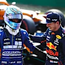MONZA, ITALY - SEPTEMBER 11: Second place finisher Max Verstappen of Netherlands and Red Bull Racing talks with third place finisher Daniel Ricciardo of Australia and McLaren F1 in parc ferme during the Sprint ahead of the F1 Grand Prix of Italy at Autodromo di Monza on September 11, 2021 in Monza, Italy. (Photo by Bryn Lennon/Getty Images)