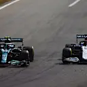 MONZA, ITALY - SEPTEMBER 12: Sebastian Vettel of Germany driving the (5) Aston Martin AMR21 Mercedes and George Russell of Great Britain driving the (63) Williams Racing FW43B Mercedes on track during the F1 Grand Prix of Italy at Autodromo di Monza on September 12, 2021 in Monza, Italy. (Photo by Dan Istitene - Formula 1/Formula 1 via Getty Images)