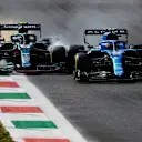 MONZA, ITALY - SEPTEMBER 12: Esteban Ocon of France driving the (31) Alpine A521 Renault and Sebastian Vettel of Germany driving the (5) Aston Martin AMR21 Mercedes collide during the F1 Grand Prix of Italy at Autodromo di Monza on September 12, 2021 in Monza, Italy. (Photo by Rudy Carezzevoli/Getty Images)