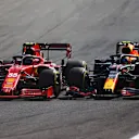 MONZA, ITALY - SEPTEMBER 12: Sergio Perez of Mexico driving the (11) Red Bull Racing RB16B Honda and Carlos Sainz of Spain driving the (55) Scuderia Ferrari SF21 during the F1 Grand Prix of Italy at Autodromo di Monza on September 12, 2021 in Monza, Italy. (Photo by Dan Istitene - Formula 1/Formula 1 via Getty Images)
