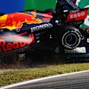 MONZA, ITALY - SEPTEMBER 12: Max Verstappen of the Netherlands driving the (33) Red Bull Racing RB16B Honda and Lewis Hamilton of Great Britain driving the (44) Mercedes AMG Petronas F1 Team Mercedes W12 crash during the F1 Grand Prix of Italy at Autodromo di Monza on September 12, 2021 in Monza, Italy. (Photo by Dan Istitene - Formula 1/Formula 1 via Getty Images)