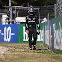 MONZA, ITALY - SEPTEMBER 12: Lewis Hamilton of Great Britain and Mercedes GP walks back to the pits after crashing during the F1 Grand Prix of Italy at Autodromo di Monza on September 12, 2021 in Monza, Italy. (Photo by Lars Baron/Getty Images)