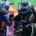MONZA, ITALY - SEPTEMBER 12: Race winner Daniel Ricciardo of Australia and McLaren F1 and third placed Valtteri Bottas of Finland and Mercedes GP celebrate in parc ferme during the F1 Grand Prix of Italy at Autodromo di Monza on September 12, 2021 in Monza, Italy. (Photo by Clive Mason - Formula 1/Formula 1 via Getty Images)