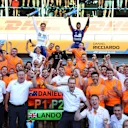 MONZA, ITALY - SEPTEMBER 12: Race winner Daniel Ricciardo of Australia and McLaren F1 and second placed Lando Norris of Great Britain and McLaren F1 celebrate with their team after the F1 Grand Prix of Italy at Autodromo di Monza on September 12, 2021 in Monza, Italy. (Photo by Bryn Lennon/Getty Images)