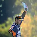 MONZA, ITALY - SEPTEMBER 12: Race winner Daniel Ricciardo of Australia and McLaren F1 celebrates on the podium during the F1 Grand Prix of Italy at Autodromo di Monza on September 12, 2021 in Monza, Italy. (Photo by Clive Mason - Formula 1/Formula 1 via Getty Images)