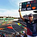 MEXICO CITY, MEXICO - NOVEMBER 05: A Sergio Perez of Mexico and Red Bull Racing fan shows their support in the grandstand during practice ahead of the F1 Grand Prix of Mexico at Autodromo Hermanos Rodriguez on November 05, 2021 in Mexico City, Mexico. (Photo by Mark Thompson/Getty Images)