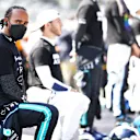 MEXICO CITY, MEXICO - NOVEMBER 07: Lewis Hamilton of Great Britain and Mercedes GP takes a knee on the grid as part of the We Race As One gesture before the F1 Grand Prix of Mexico at Autodromo Hermanos Rodriguez on November 07, 2021 in Mexico City, Mexico. (Photo by Bryn Lennon - Formula 1/Formula 1 via Getty Images)