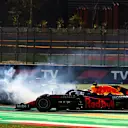 MEXICO CITY, MEXICO - NOVEMBER 07: Sergio Perez of Mexico driving the (11) Red Bull Racing RB16B Honda passes Valtteri Bottas of Finland driving the (77) Mercedes AMG Petronas F1 Team Mercedes W12 as he spins during the F1 Grand Prix of Mexico at Autodromo Hermanos Rodriguez on November 07, 2021 in Mexico City, Mexico. (Photo by Mark Thompson/Getty Images)