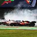 MEXICO CITY, MEXICO - NOVEMBER 07: Carlos Sainz of Spain driving the (55) Scuderia Ferrari SF21 and Charles Leclerc of Monaco driving the (16) Scuderia Ferrari SF21 at the start during the F1 Grand Prix of Mexico at Autodromo Hermanos Rodriguez on November 07, 2021 in Mexico City, Mexico. (Photo by Mark Thompson/Getty Images)