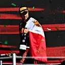 MEXICO CITY, MEXICO - NOVEMBER 07: Third placed Sergio Perez of Mexico and Red Bull Racing celebrates on the podium during the F1 Grand Prix of Mexico at Autodromo Hermanos Rodriguez on November 07, 2021 in Mexico City, Mexico. (Photo by Clive Mason/Getty Images)