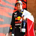 MEXICO CITY, MEXICO - NOVEMBER 07: Third placed Sergio Perez of Mexico and Red Bull Racing celebrates on the podium during the F1 Grand Prix of Mexico at Autodromo Hermanos Rodriguez on November 07, 2021 in Mexico City, Mexico. (Photo by Bryn Lennon - Formula 1/Formula 1 via Getty Images)