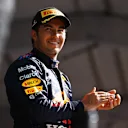 MEXICO CITY, MEXICO - NOVEMBER 07: Third placed Sergio Perez of Mexico and Red Bull Racing celebrates on the podium during the F1 Grand Prix of Mexico at Autodromo Hermanos Rodriguez on November 07, 2021 in Mexico City, Mexico. (Photo by Bryn Lennon - Formula 1/Formula 1 via Getty Images)