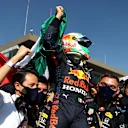 MEXICO CITY, MEXICO - NOVEMBER 07: Third placed Sergio Perez of Mexico and Red Bull Racing celebrates in parc ferme during the F1 Grand Prix of Mexico at Autodromo Hermanos Rodriguez on November 07, 2021 in Mexico City, Mexico. (Photo by Bryn Lennon - Formula 1/Formula 1 via Getty Images)