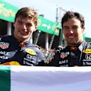 MEXICO CITY, MEXICO - NOVEMBER 07: Race winner Max Verstappen of Netherlands and Red Bull Racing and third placed Sergio Perez of Mexico and Red Bull Racing celebrate in parc ferme during the F1 Grand Prix of Mexico at Autodromo Hermanos Rodriguez on November 07, 2021 in Mexico City, Mexico. (Photo by Bryn Lennon - Formula 1/Formula 1 via Getty Images)