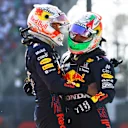 MEXICO CITY, MEXICO - NOVEMBER 07: Race winner Max Verstappen of Netherlands and Red Bull Racing and third placed Sergio Perez of Mexico and Red Bull Racing celebrate in parc ferme during the F1 Grand Prix of Mexico at Autodromo Hermanos Rodriguez on November 07, 2021 in Mexico City, Mexico. (Photo by Bryn Lennon - Formula 1/Formula 1 via Getty Images)
