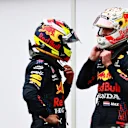 MONTE-CARLO, MONACO - MAY 22: Second place qualifier Max Verstappen of Netherlands and Red Bull Racing talks with Sergio Perez of Mexico and Red Bull Racing in parc ferme during qualifying for the F1 Grand Prix of Monaco at Circuit de Monaco on May 22, 2021 in Monte-Carlo, Monaco. (Photo by Mark Thompson/Getty Images)